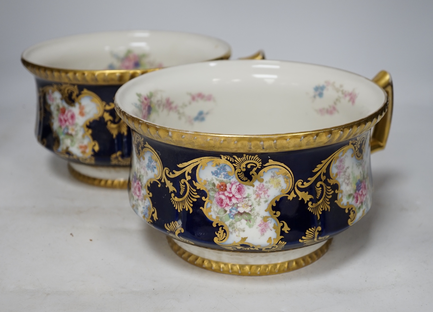 D. & C. Limoges, France, a pair of late 19th / early 20th century chamber pots, 21cm diameter. Condition - fair, some wear